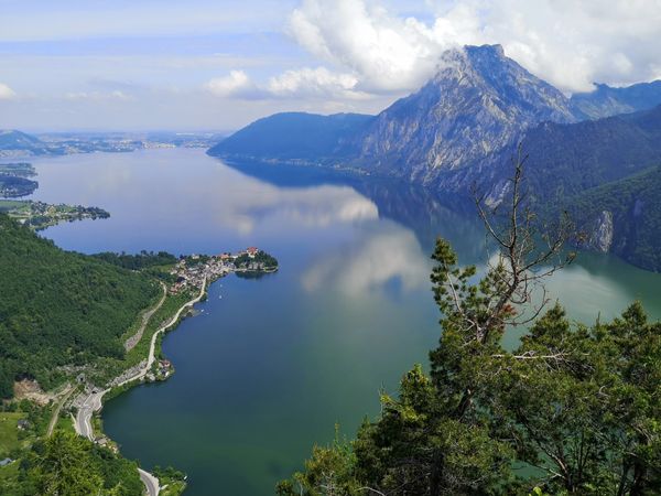 View from top of a mountain onto a sea and another mountain in
      austria.